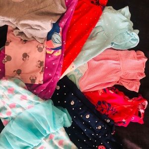 Lot of baby girl clothing.